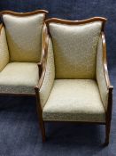 A PAIR OF INLAID EDWARDIAN HIGHBACK ARMCHAIRS WITH SHAPED CRESTRAILS ABOVE SCROLLING ARMS