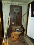 AN UNUSUAL VINTAGE DISPLAY SCALE MODEL OF A FLUSH TOILET IN A FITTED DISPLAY CASE.