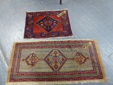 AN UNUSUAL PERSIAN SERAB SMALL RUG. 138 x 60cms TOGETHER WITH AN ANTIQUE AFSHAR BAG FACE.