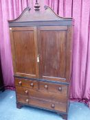 A LATE GEORGIAN COLONIAL HARDWOOD LINEN PRESS WITH SHAPED CORNICE OVER PANELLED DOORS ENCLOSING FOU