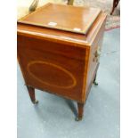 A LATE GEORGIAN INLAID MAHOGANY CELLARETTE WITH FITTED INTERIOR AND TAPERED LEGS ENDING IN BRASS