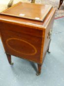 A LATE GEORGIAN INLAID MAHOGANY CELLARETTE WITH FITTED INTERIOR AND TAPERED LEGS ENDING IN BRASS