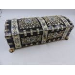 AN ORNATE TORTOISESHELL AND IVORY INDIAN DOME TOP DRESSER BOX WITH PAW FEET. W.26cms.