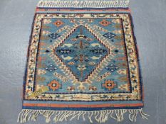 A TURKISH TRIBAL RUG. 124 x 120cms