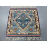 A TURKISH TRIBAL RUG. 124 x 120cms