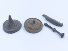 A ROMAN BRONZE COSMETIC SET TOGETHER WITH TWO BRONZE PHALERA.