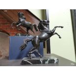 TWO ANTIQUE GRAND TOUR BRONZE FIGURES OF PRANCING HORSES AFTER THE ANTIQUE ON LATER MARBLE BASES.