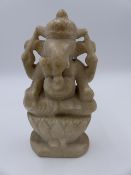 AN INDIAN CARVED MARBLE FIGURE OF GANESH. H.20cms.