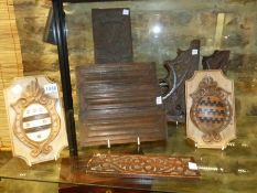 A GROUP OF 18th.C. AND LATER CARVED WOOD ELEMENTS TO INCLUDE LINEN FOLD PANELS, ARMORIAL PLAQUES,