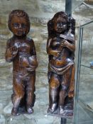 TWO ANTIQUE CARVED OAK STANDING FIGURES, ONE HOLDING A BOOK THE OTHER A CROSS. H.33cms.