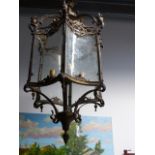 AN IMPRESSIVE FRENCH STYLE HALL LANTERN OF LARGE SIZE WITH SHAPED DECORATED GLAZED PANELS AND SCROLL