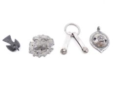 ROMAN WHITE METAL (SILVER) PENDANTS AND FRAGMENTS IN THE FORM OF A LION'S HEAD, ETC.
