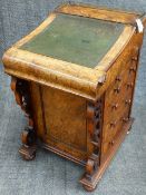 AN UNUSUAL VICTORIAN CARVED BURL WALNUT DAVENPORT DESK WITH SLIDING INSET LEATHER TOP AND FITTED