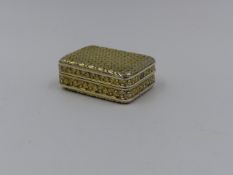 A SILVER GILT VINAIGRETTE IN A ROUNDED RECTANGULAR FORM, THE SURFACE EMBELLISHED WITH A FINE CUT