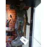 A PATINATED PLASTER FIGURE AFTER THE ANTIQUE OF THE DANCING FAUN WITH CLAPPERS. H.30cms.
