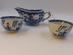 A CHINESE EXPORT BLUE AND WHITE SAUCEBOAT AND TWO TEA BOWLS.