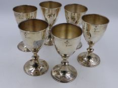 A SET OF SIX STERLING SILVER GOBLETS WITH IMPORT DUTY MARKS FOR LONDON 1974. 13cms HIGH.