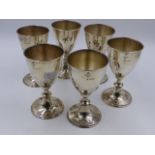 A SET OF SIX STERLING SILVER GOBLETS WITH IMPORT DUTY MARKS FOR LONDON 1974. 13cms HIGH.