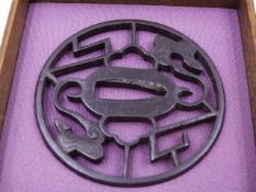 A PIERCED IRON TSUBA, DECORATED WITH STYLIZED CLOUDS AND LIGHTENING BOLTS