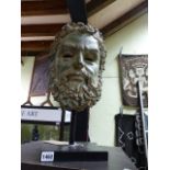 A VERDIGRIS PATINATED BRONZE HEAD OF A BEARDED MAN AFTER THE ANTIQUE MOUNTED ON A CONTEMPORARY