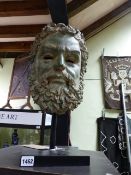 A VERDIGRIS PATINATED BRONZE HEAD OF A BEARDED MAN AFTER THE ANTIQUE MOUNTED ON A CONTEMPORARY