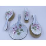 A HALLMARKED SILVER FIVE PIECE DRESSING TABLE SET DATED LONDON 1962 WITH A GUILLOCHE ENAMEL FLORAL