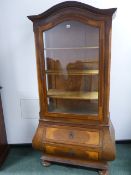 A CONTINENTAL INLAID WALNUT GLAZED DOOR DISPLAY CABINET IN THE 18th.C.GERMAN TASTE, BOMBE BASE