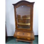 A CONTINENTAL INLAID WALNUT GLAZED DOOR DISPLAY CABINET IN THE 18th.C.GERMAN TASTE, BOMBE BASE