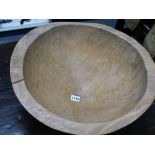 A RUSTIC CARVED DEEP TREEN CONICAL FORM BOWL. H.26, DIA. 43cms.