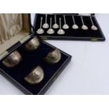 A CASED SET OF FOUR SILVER TABLE SALTS, LONDON 1879 AND NINE SILVER TEASPOONS, c. 1960'S. ASSORTED