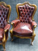 A PAIR OF CARVED ARMCHAIRS IN THE VICTORIAN STYLE COVERED IN CLARET STUDDED LEATHER.