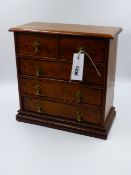 A MINIATURE YEW WOOD CHEST OF DRAWERS OF TWO SHORT DRAWERS OVER THREE LONG DRAWERS. H.30cms.