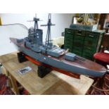 A SCRATCH BUILT MODEL OF A BATTLESHIP CONSTRUCTED AS A WORKING MODEL WITH TWIN ELECTRIC MOTORS.