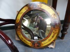 AN EARLY 20th.C.POLYCHROME DECORATED CIRCULAR MIRROR, THE FRAME PAINTED WITH PUNCH AND JUDY