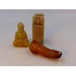 THREE CHINESE CARVED HARDSTONE ARTICLES, A SEATED DEITY, A SEAL AND AN ARCHAIC RITUAL OBJECT.
