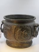 AN ANTIQUE JAPANESE BRONZE JARDINIERE DECORATED WITH PANELS OF WARRIORS WITH MASK LOOSE RING