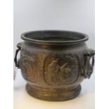 AN ANTIQUE JAPANESE BRONZE JARDINIERE DECORATED WITH PANELS OF WARRIORS WITH MASK LOOSE RING