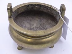 A CHINESE POLISHED BRONZE TWI HANDLED TRIFID FOOTED CENSER WITH SIX CHARACTER MARKS TO BASE AND