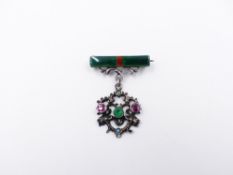 A 935 SILVER STAMPED SUFFRAGETTE ARTICULATED BAR BROOCH WITH A FLORAL STONE SET DROPPER. APPROX