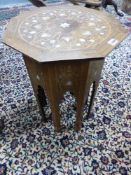 AN ANTIQUE SYRIAN INLAID HARDWOOD OCTAGONAL STAND WITH MOTHER OF PEARL INSETS. H.57, D.45cms.