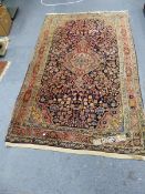 A PERSIAN SAROUK RUG. 214 x 132cms.