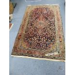 A PERSIAN SAROUK RUG. 214 x 132cms.