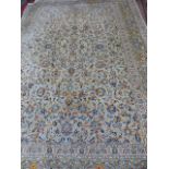 A PERSIAN KASHAN CARPET. 372 x 259cms.