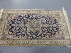 A PERSIAN NAIN RUG. 218 x 125cms.