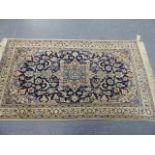 A PERSIAN NAIN RUG. 218 x 125cms.