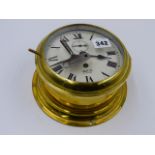 A BRASS CASED SMITHS BULKHEAD TYPE CLOCK WITH PAINTED ROMAN NUMERAL DIAL.
