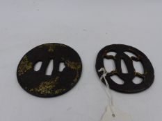 TWO IRON TSUBA, THE FIRST PIERCED AND HIGHLIGHTED WITH GILT, THE SECOND DECORATED WITH A STYLISED