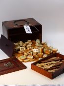 A CHINESE HARDWOOD CASED MAH-JONG SET.