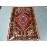 A PERSIAN HAMADAN RUG. 178 x 114cms.