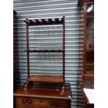 A 19th.C.MAHOGANY COUNTRY HOUSE RIDING BOOT RACK WITH TURNED SUPPORTS.